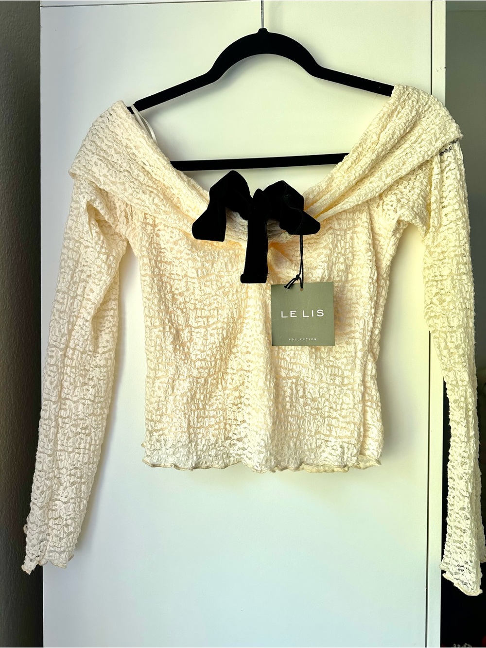 Le Lis Cream Textured Off-Shoulder Top with Black Bow Accent